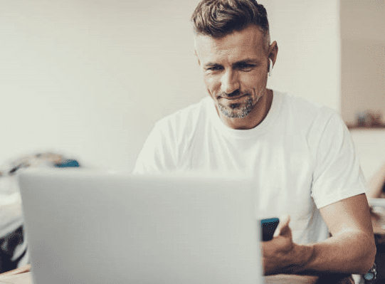 Midlife Men at his laptop